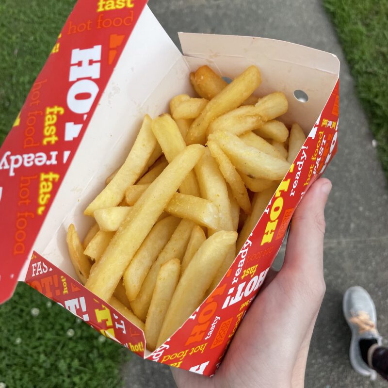 A red box of chippies in my hands