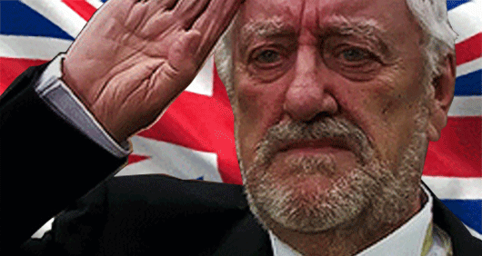 Wilfred Mott of Doctor Who fame saluting in front of a Union Jack
